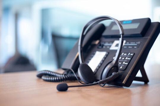 A desk phone with a headset, symbolizing RES Group's customer support for inquiries and assistance.