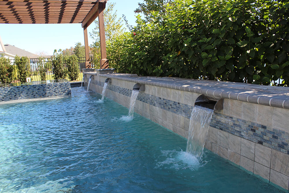 A resort-style pool featuring cascading waterfalls.