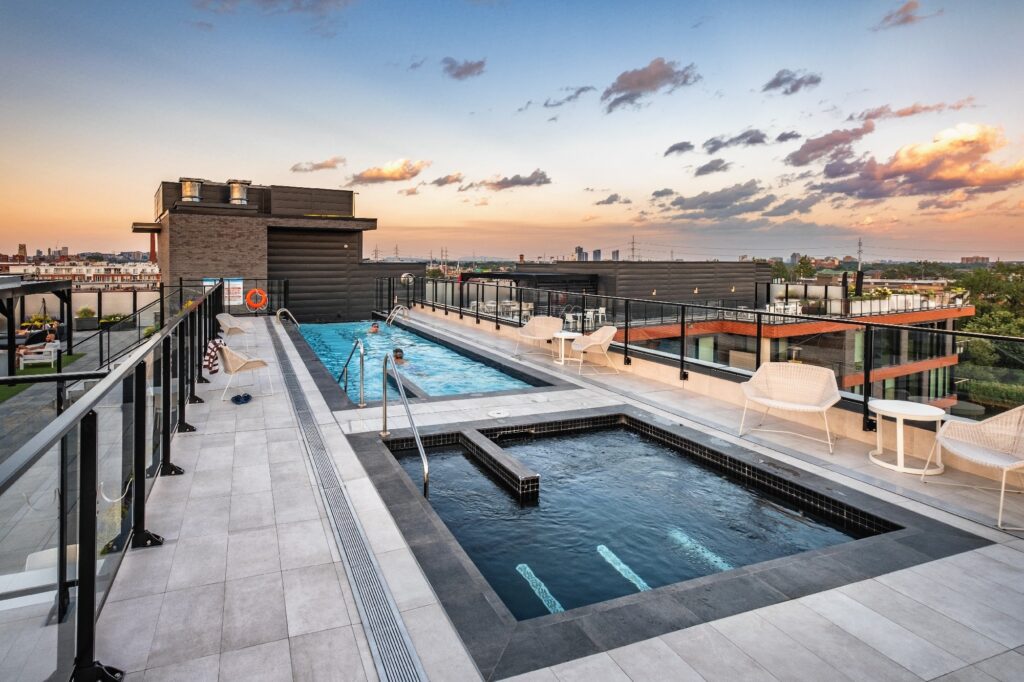 A modern rooftop pool offering panoramic city views.